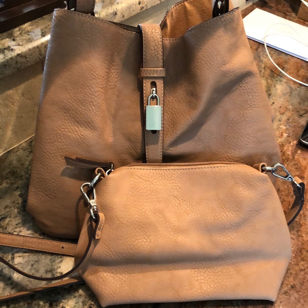 Woman’s tan bag with matching  mini cross body